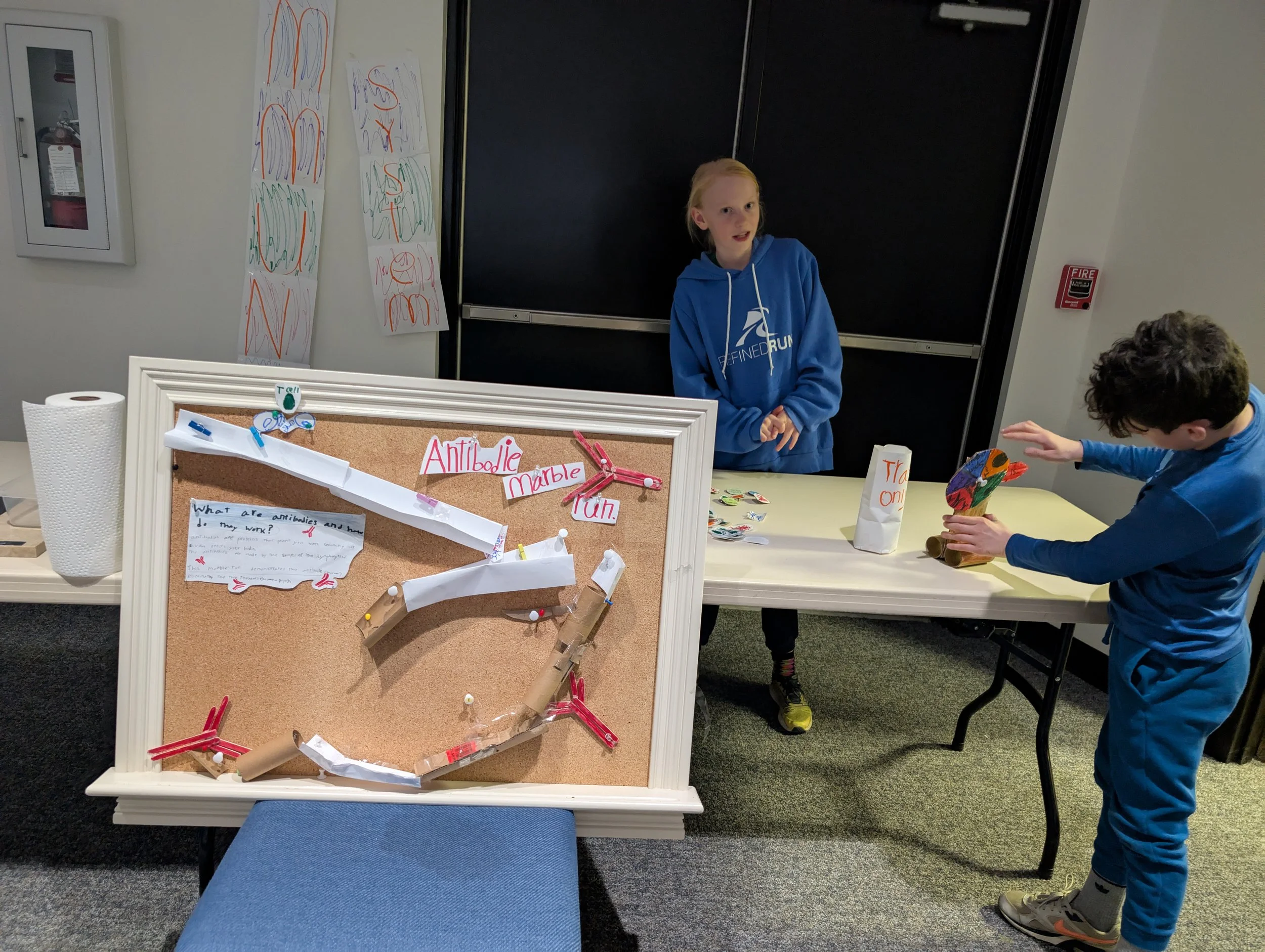 Microschool (Acton Academy) student showcasing health fair exhibition at Acton
