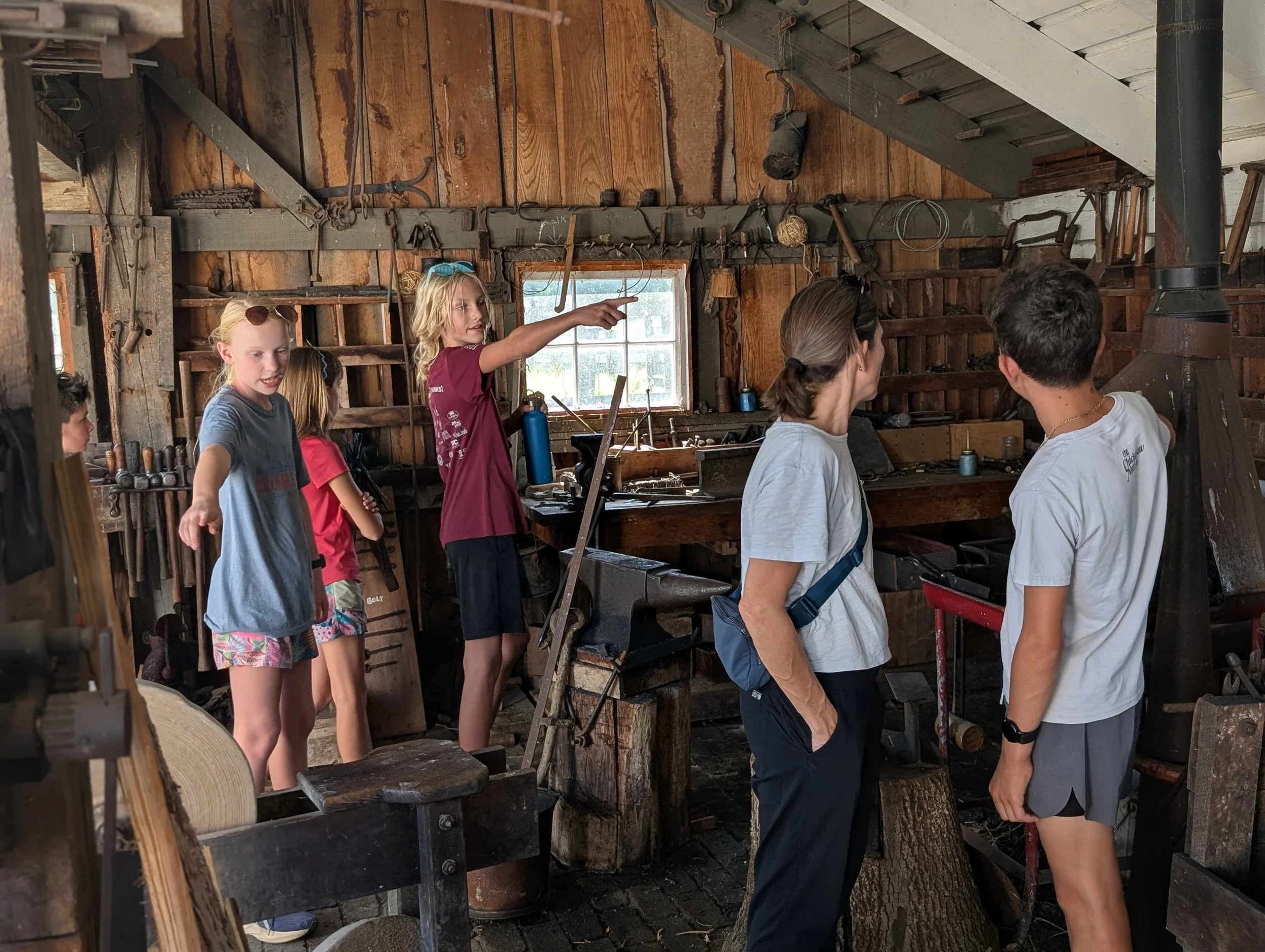Learners touring a historic workshop at Slate Run