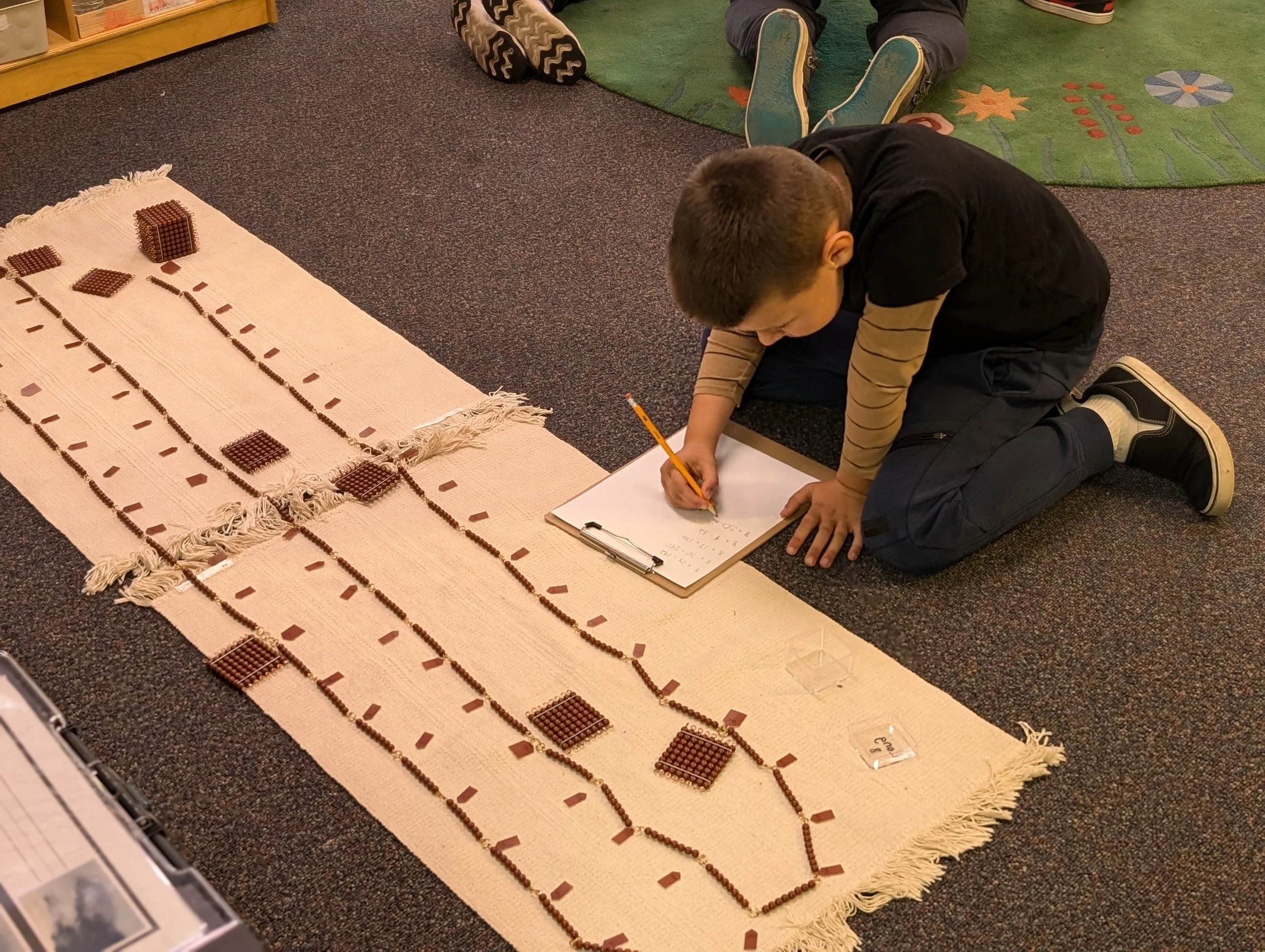 Learner working in makerspace with tools