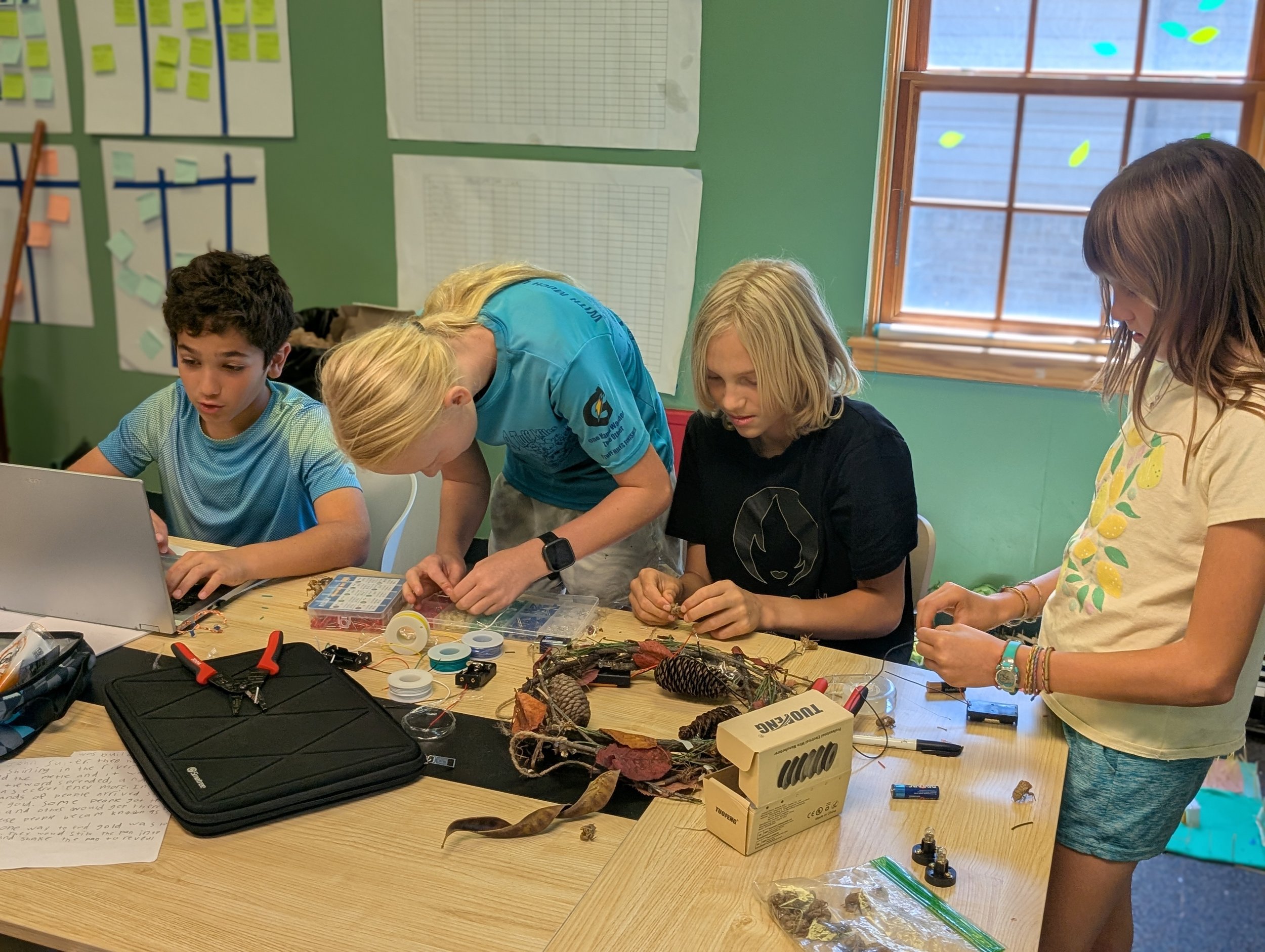 Microschool (Acton Academy Columbus) students engaged in electricity work