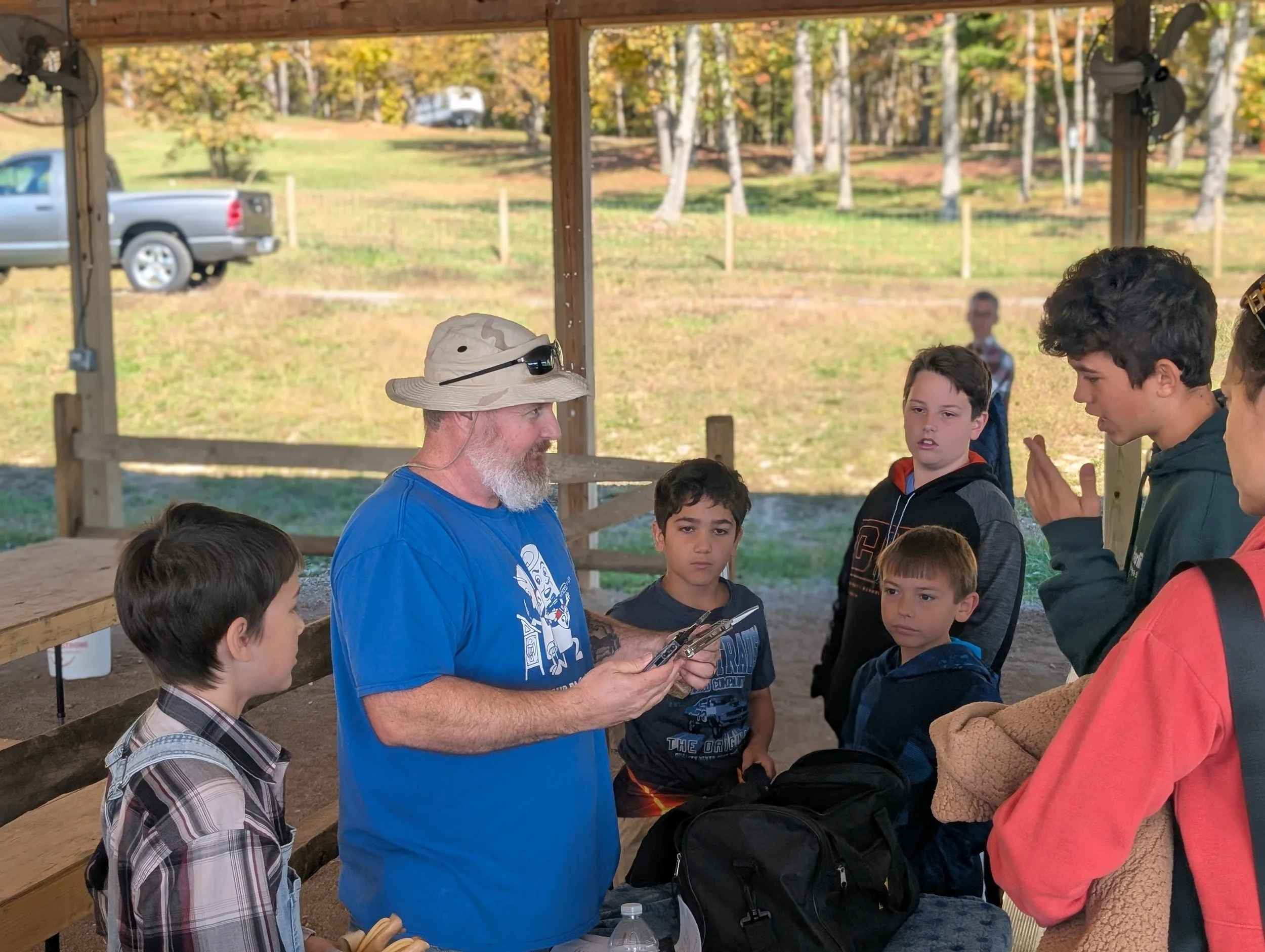 Learners talking with an adult guide about tools and craft