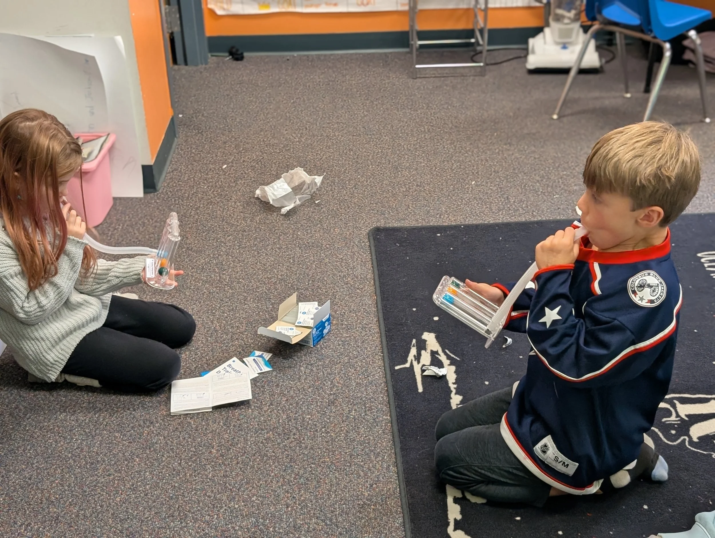 Acton Academy (Alternative School) learners using lung breathing machine