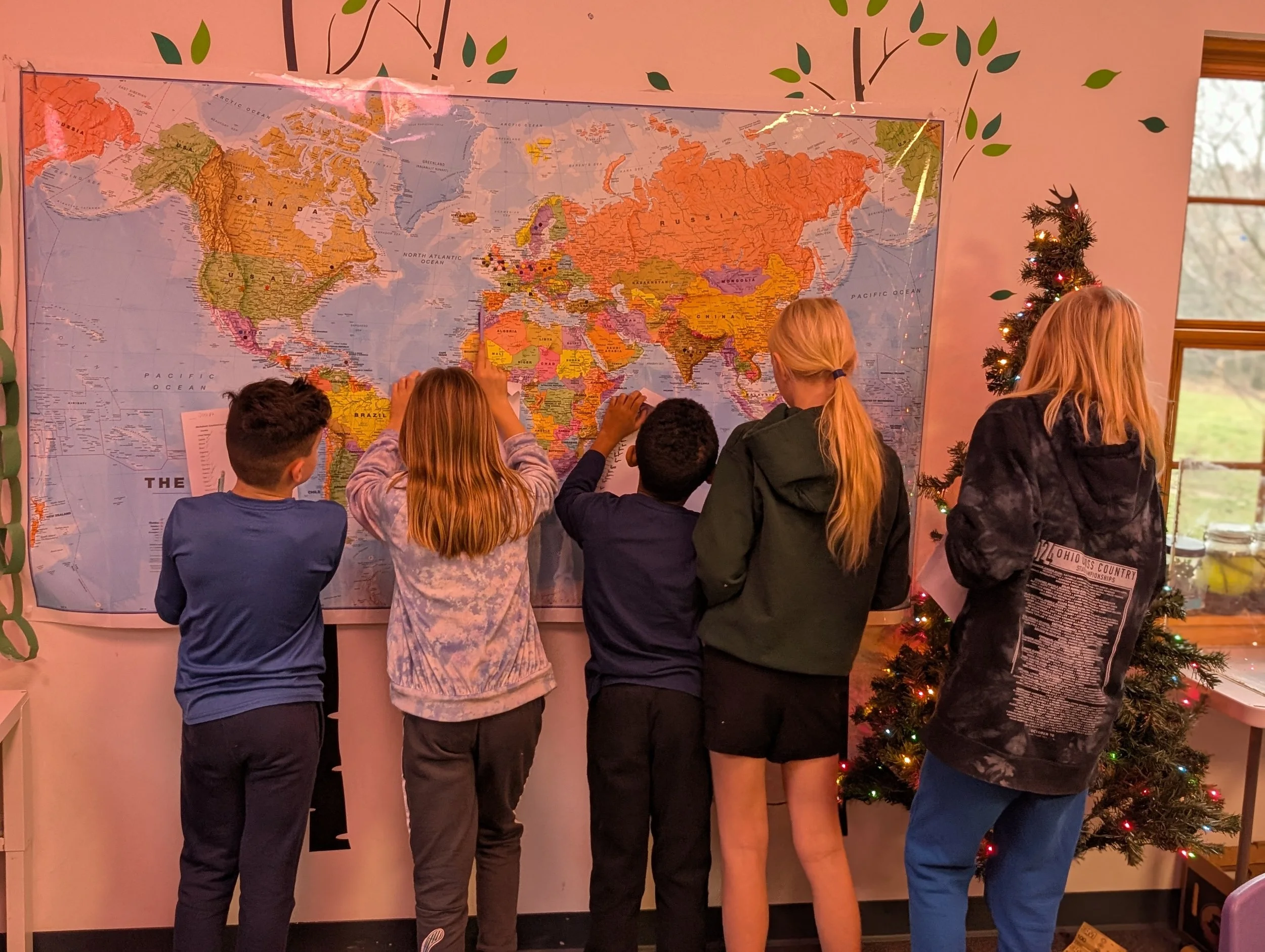 Learners at Acton Academy (private school in Columbus, OH) looking at a map
