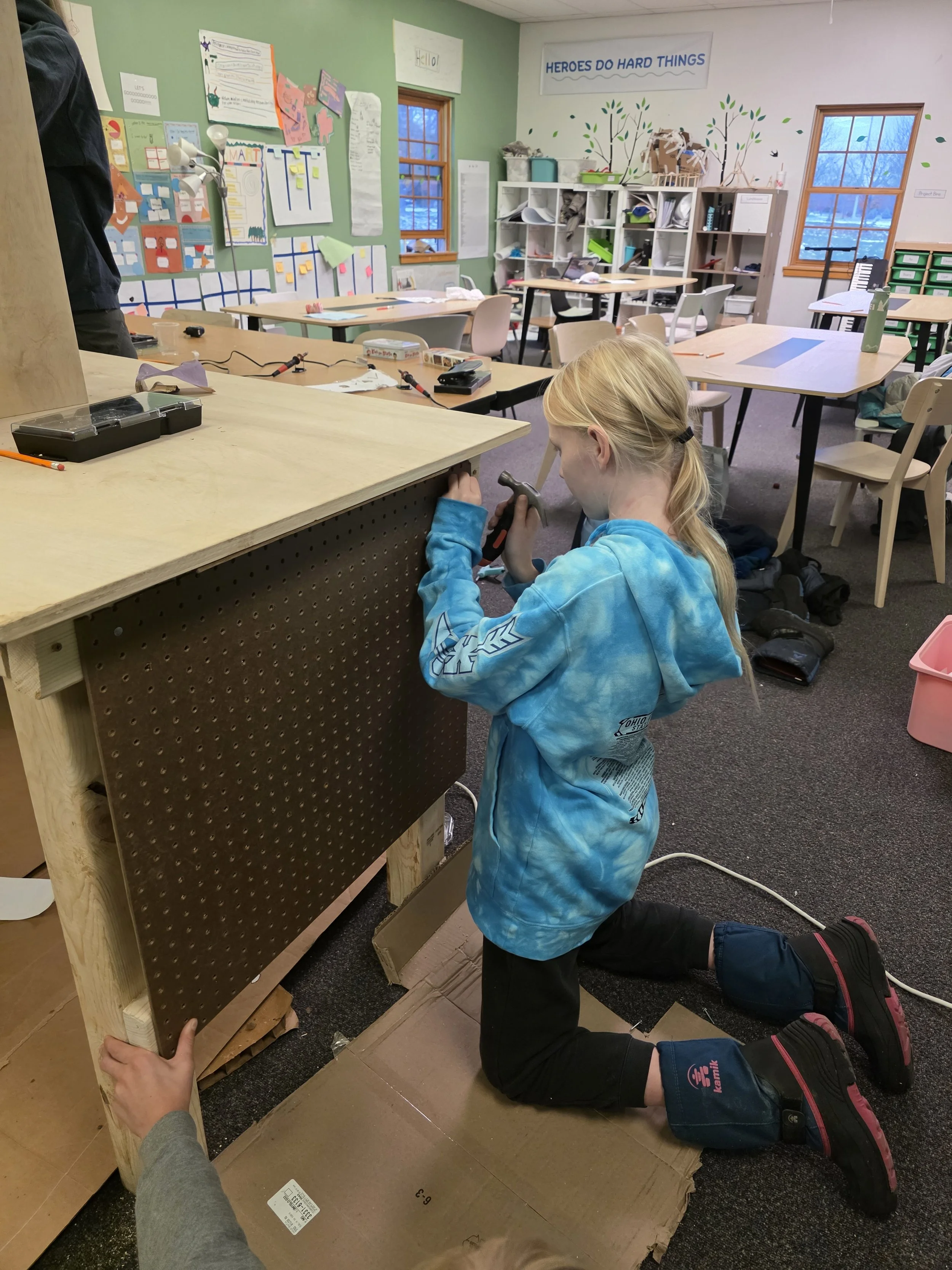 Student at private school (Acton Academy) working on woodworking