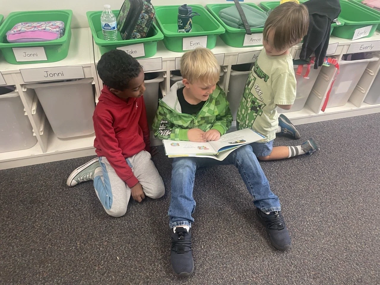 Peer-to-Peer learning: Montessori studio learners reading to each other